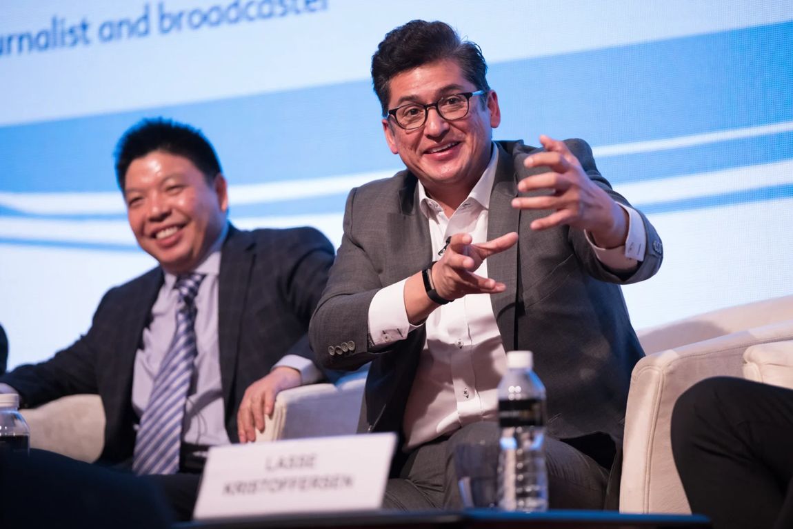 Panellists in a seated stage discussion